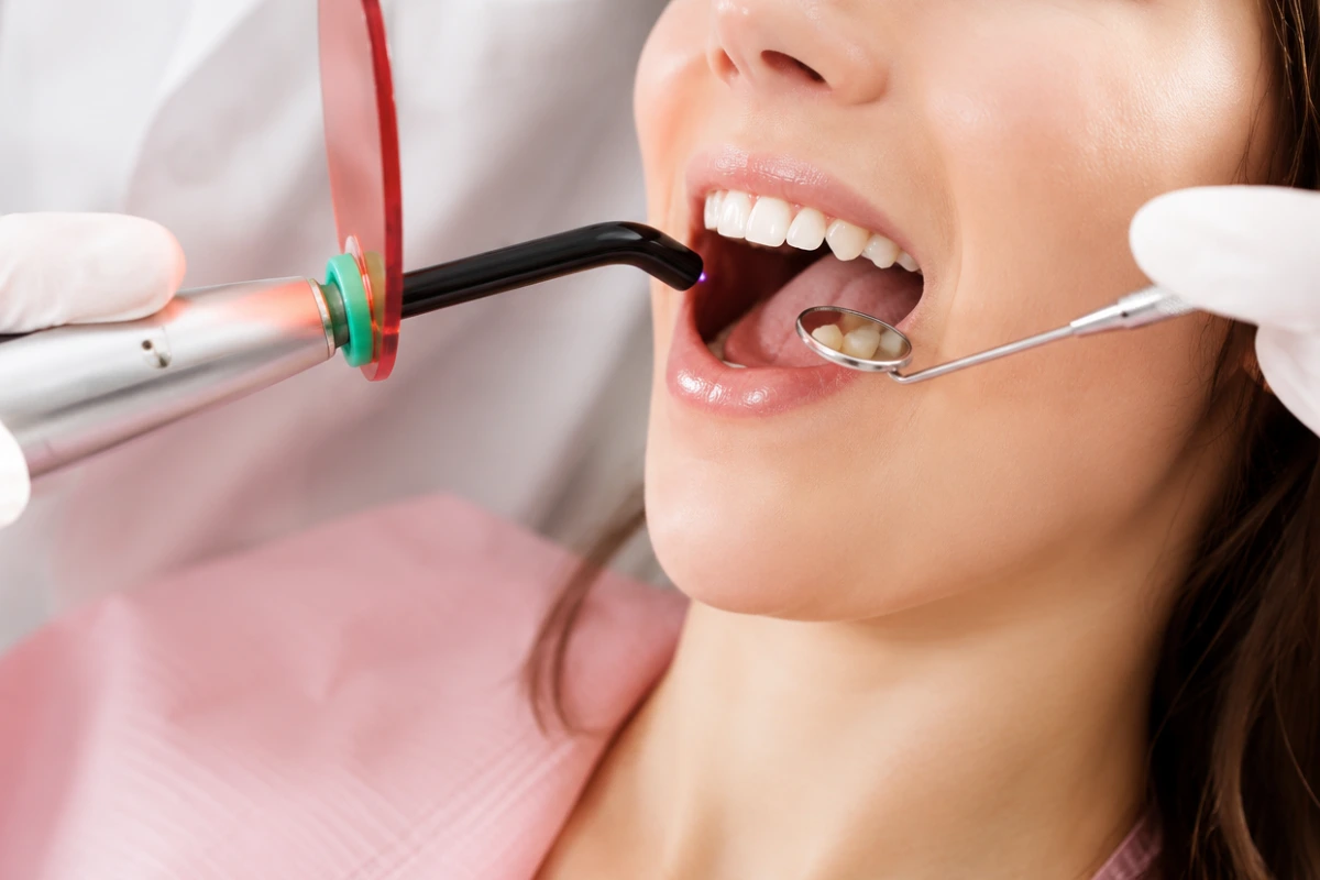 Dentist performing modern root canal treatment using advanced technology to save a natural tooth.