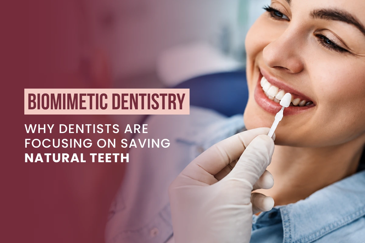 Dentist using a tooth shade guide on a smiling patient's teeth to match natural color for biomimetic dental treatment.